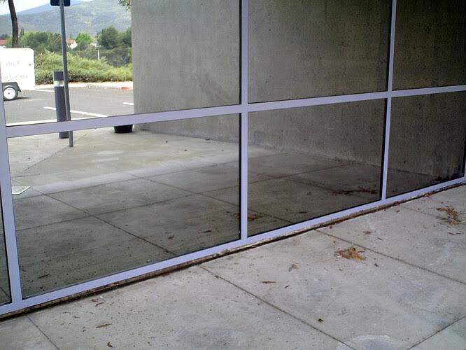 Commercial window after hard water stain removal