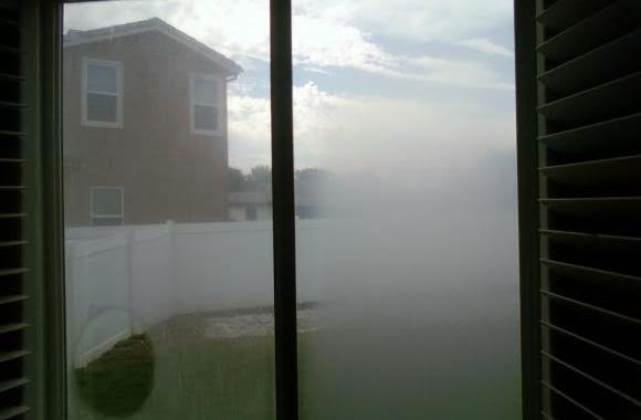 Sliding glass door before cleaning, viewed from inside